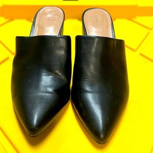 Black open back pointed shoes